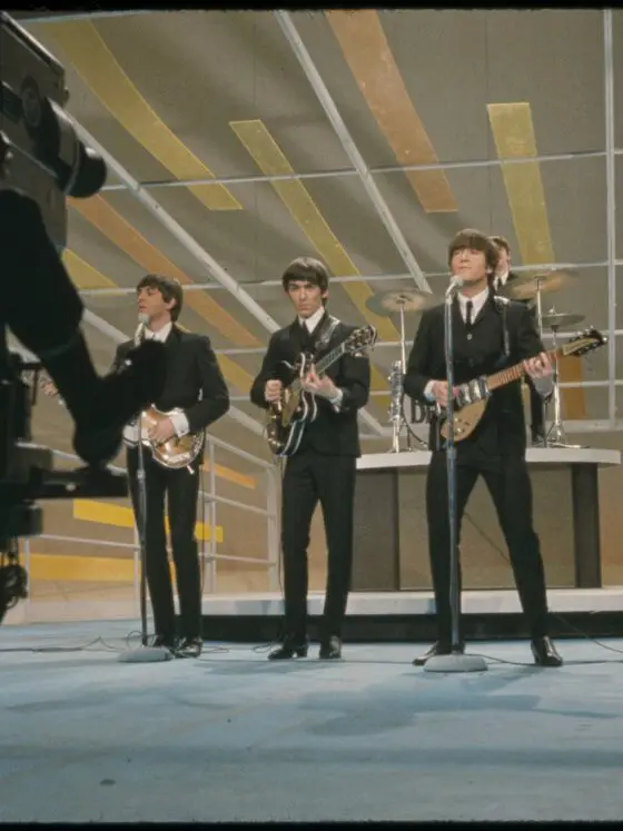 Behind the scenes shot of The Beatles performing at the Ed Sullivan Show in 1962