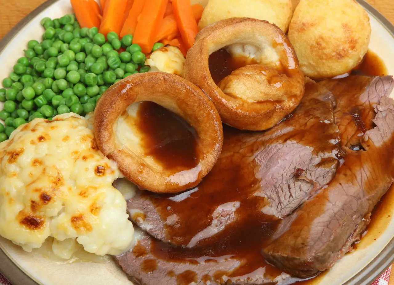 Roast beef, yorkshire pudding, cauliflower cheese, peas and carrots doused in gravy